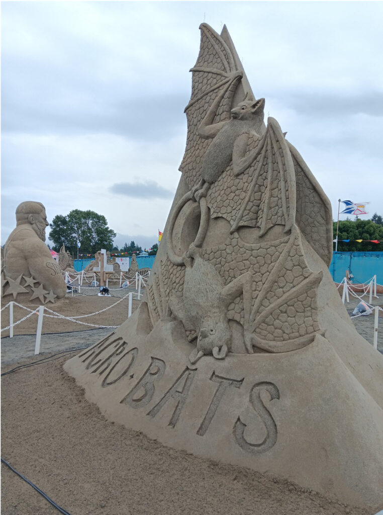 Acrobats sand sculpture